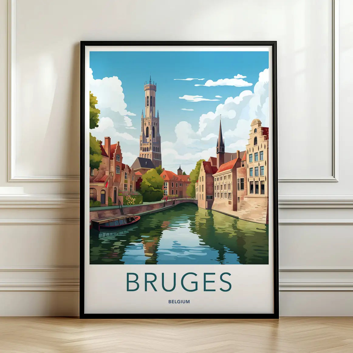 Framed travel poster of Bruges' medieval buildings and a peaceful canal leaning against a white wall.