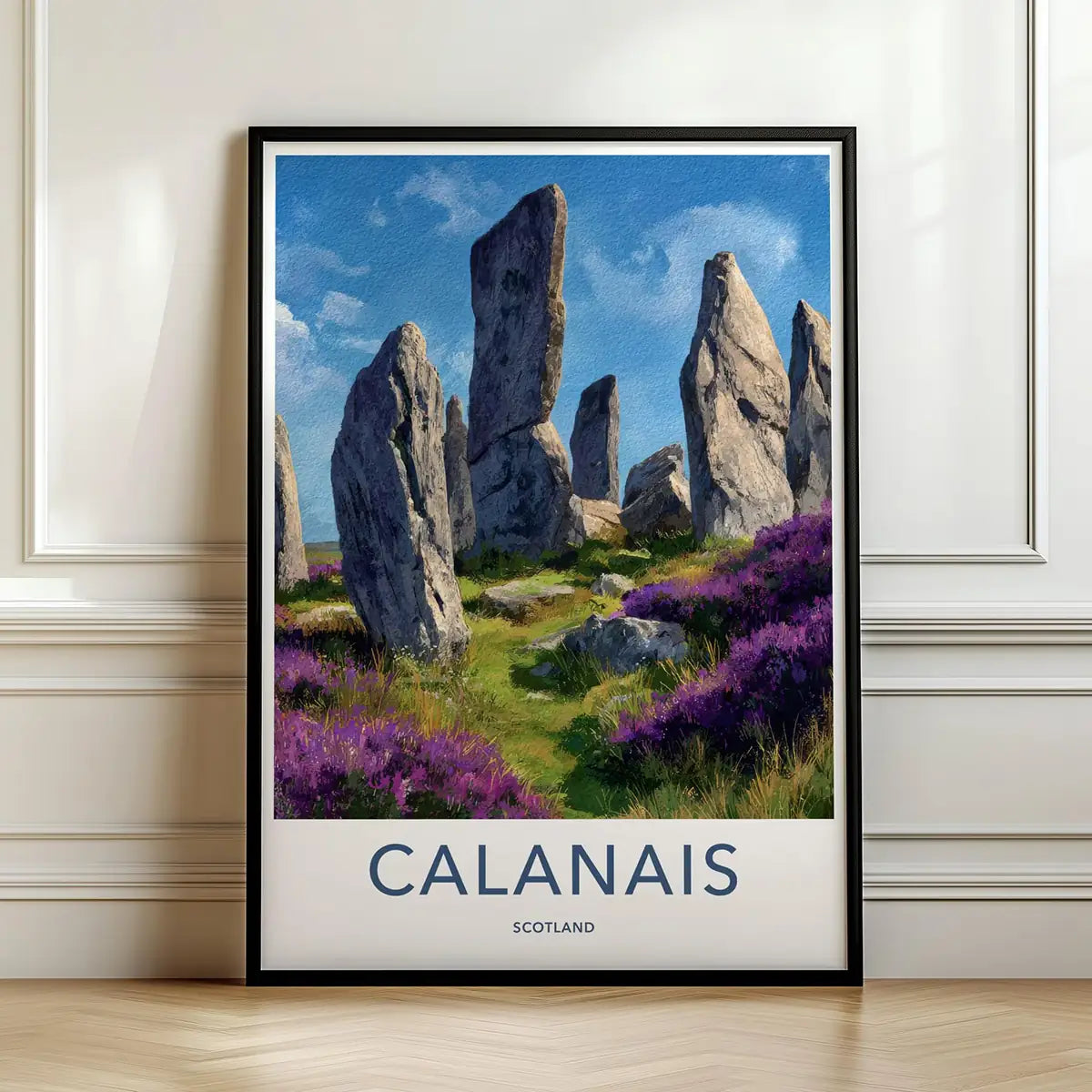 Framed travel poster of the Calanais standing stones in a grassy landscape leaning against a white wall.