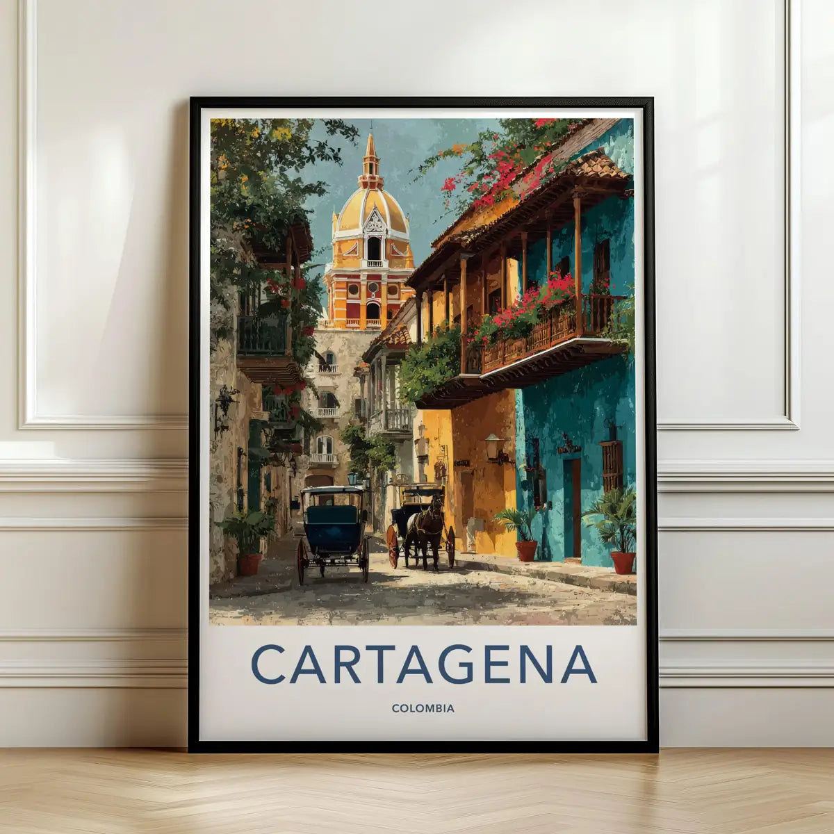 Framed travel poster of Cartagena's colorful colonial streets and wooden balconies leaning against a white wall.