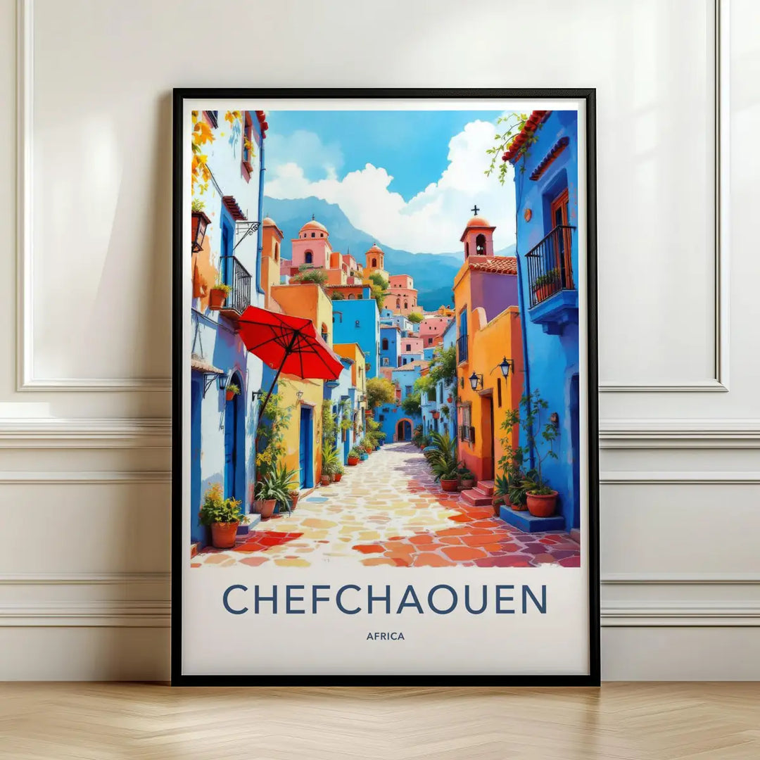 Framed travel poster of Chefchaouen's vibrant blue-painted streets and colorful pots leaning against a white wall.