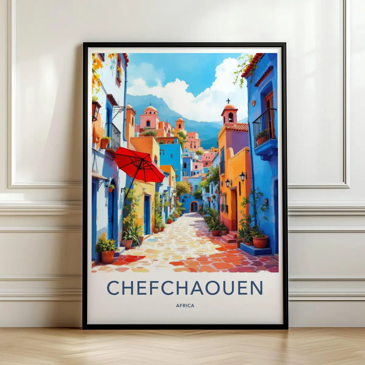 Framed travel poster of Chefchaouen's vibrant blue-painted streets and colorful pots leaning against a white wall.