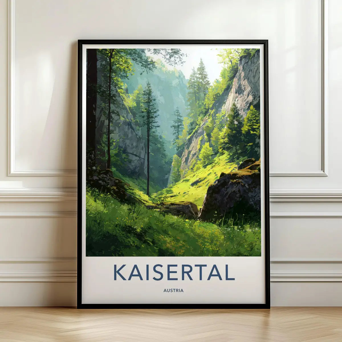 Framed travel poster of Kaisertal's lush green alpine valley and mountain peaks leaning against a white wall.
