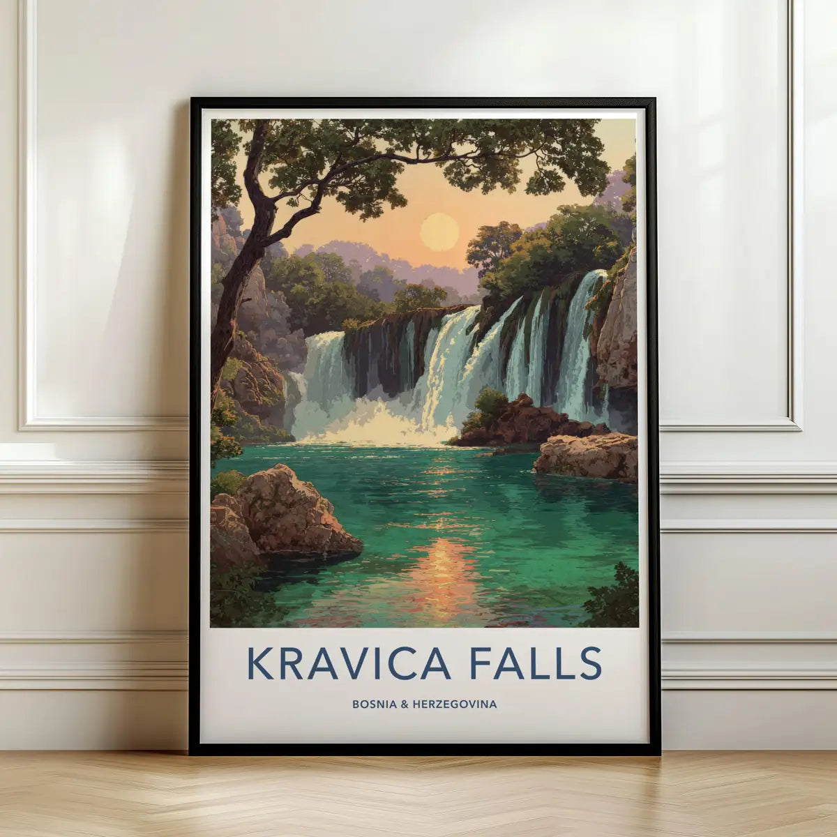 Framed travel poster of Kravica Falls cascading into a green pool leaning against a white wall.