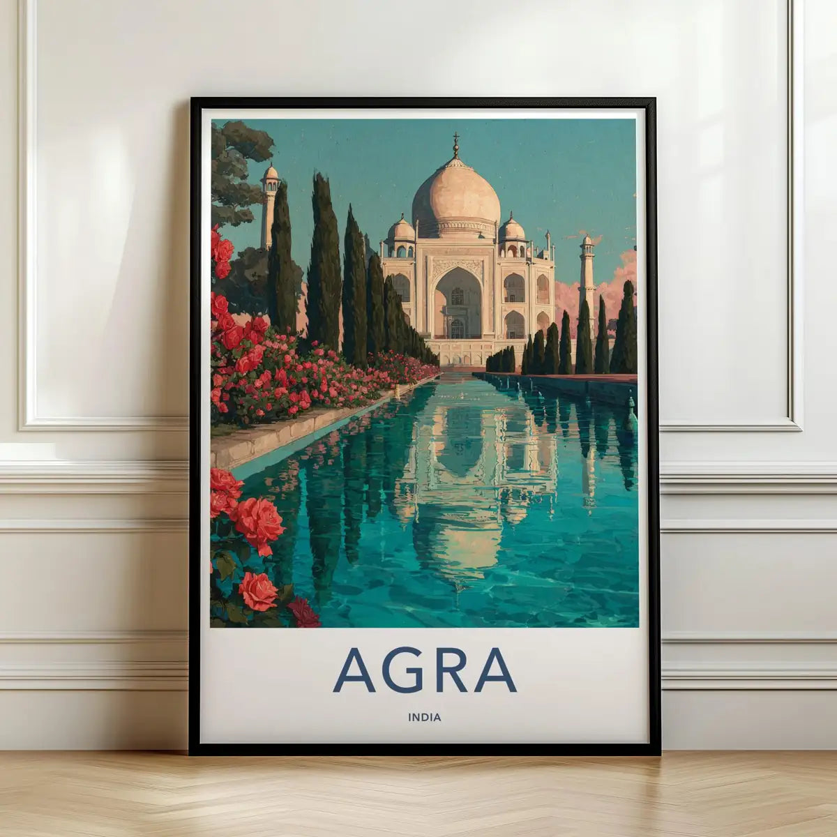 Framed travel poster of the Taj Mahal in Agra reflecting in the water at sunset leaning against a white wall.