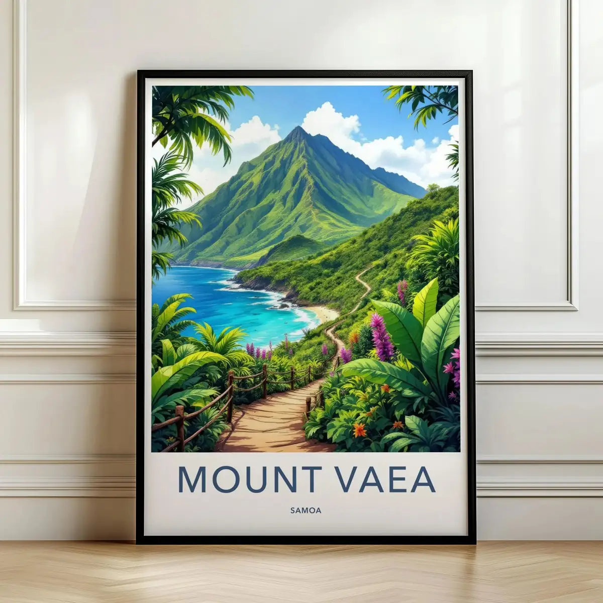 Framed travel poster of a tropical coastal path leading toward the green peak of Mount Vaea and a turquoise bay leaning against a white wall.