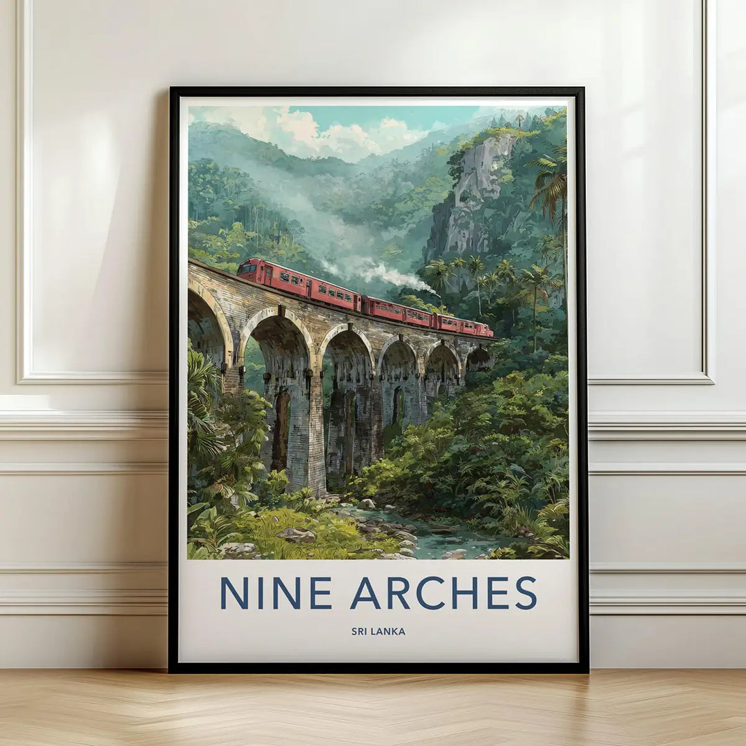 Framed travel poster of a red train crossing the Nine Arches bridge surrounded by lush green jungle leaning against a white wall.