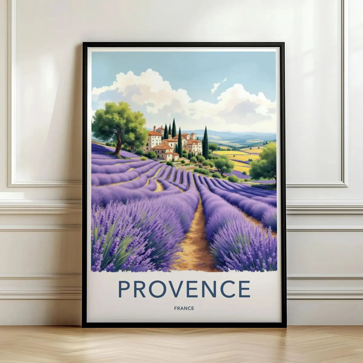 Framed travel poster of blooming purple lavender fields in Provence leading to a countryside estate leaning against a white wall.