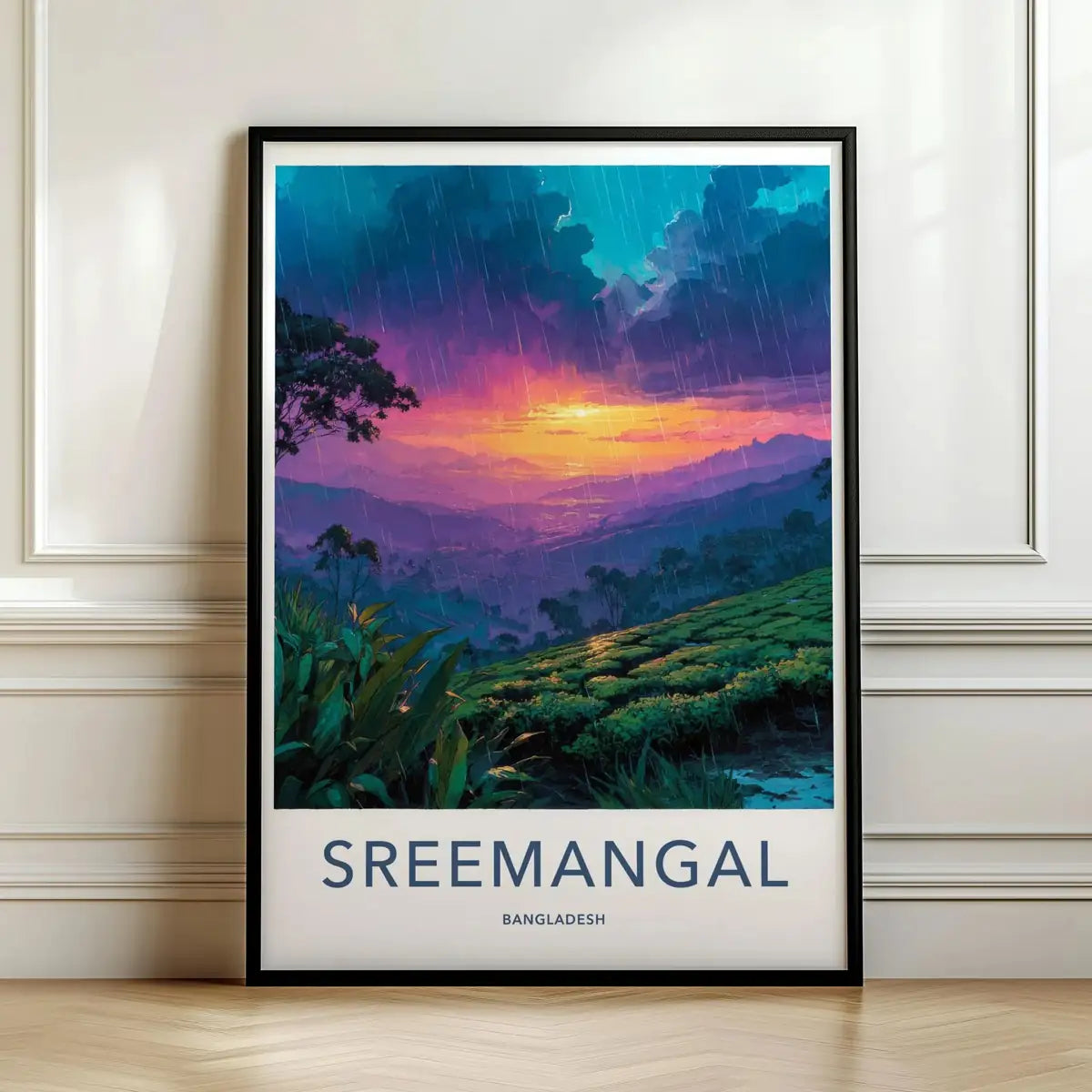 Framed travel poster of Sreemangal's rolling green tea estates at twilight leaning against a white wall.