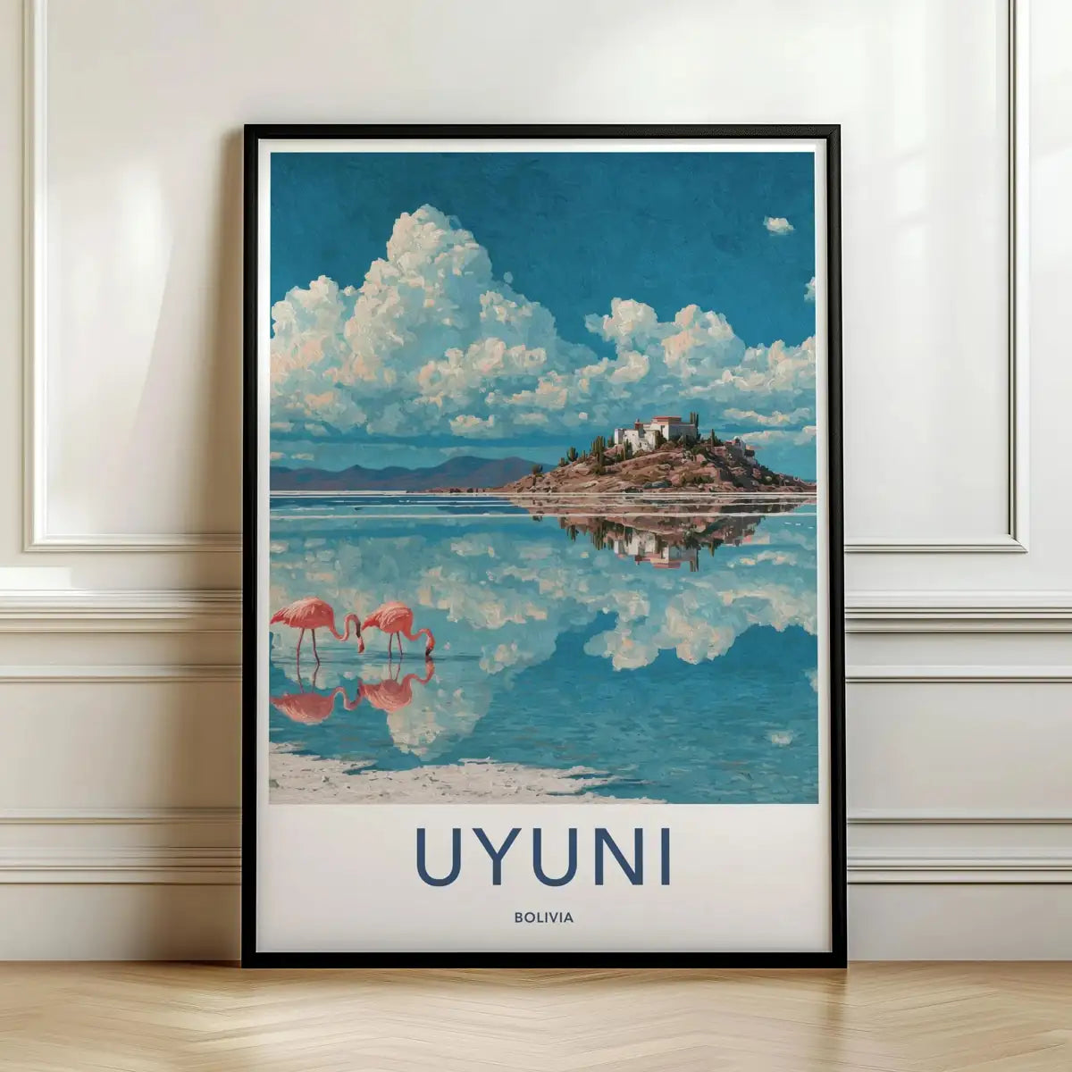 Framed travel poster of the Uyuni salt flats reflecting clouds and pink flamingos leaning against a white wall.