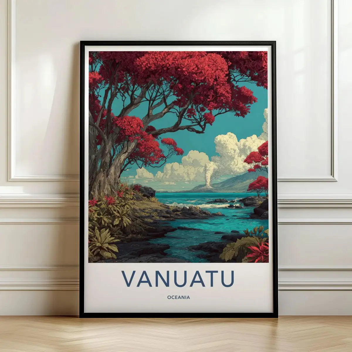 Framed travel poster of Vanuatu's vibrant red trees and coastal landscape leaning against a white wall.