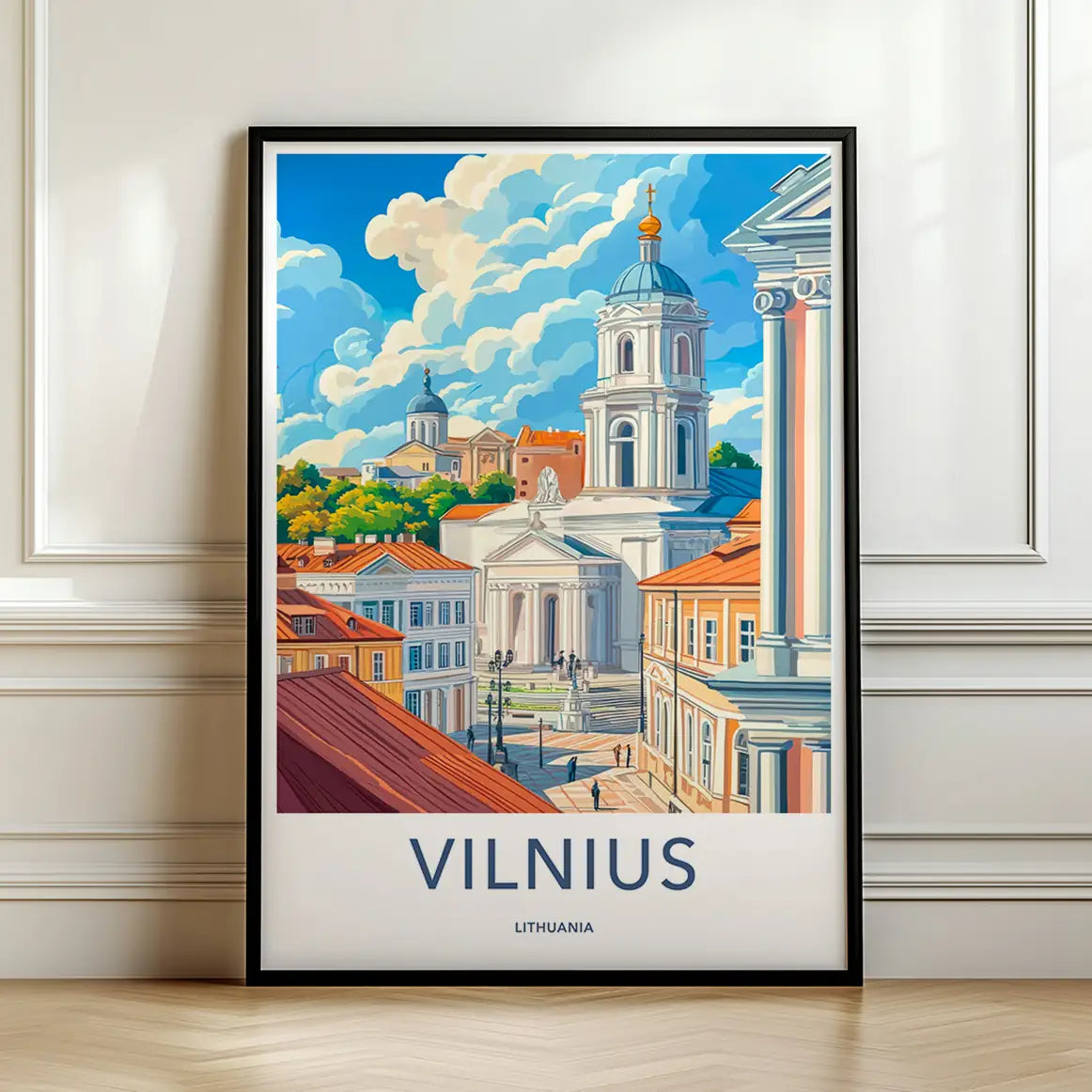 Framed travel poster of Vilnius's classic white cathedral and city skyline leaning against a white wall.