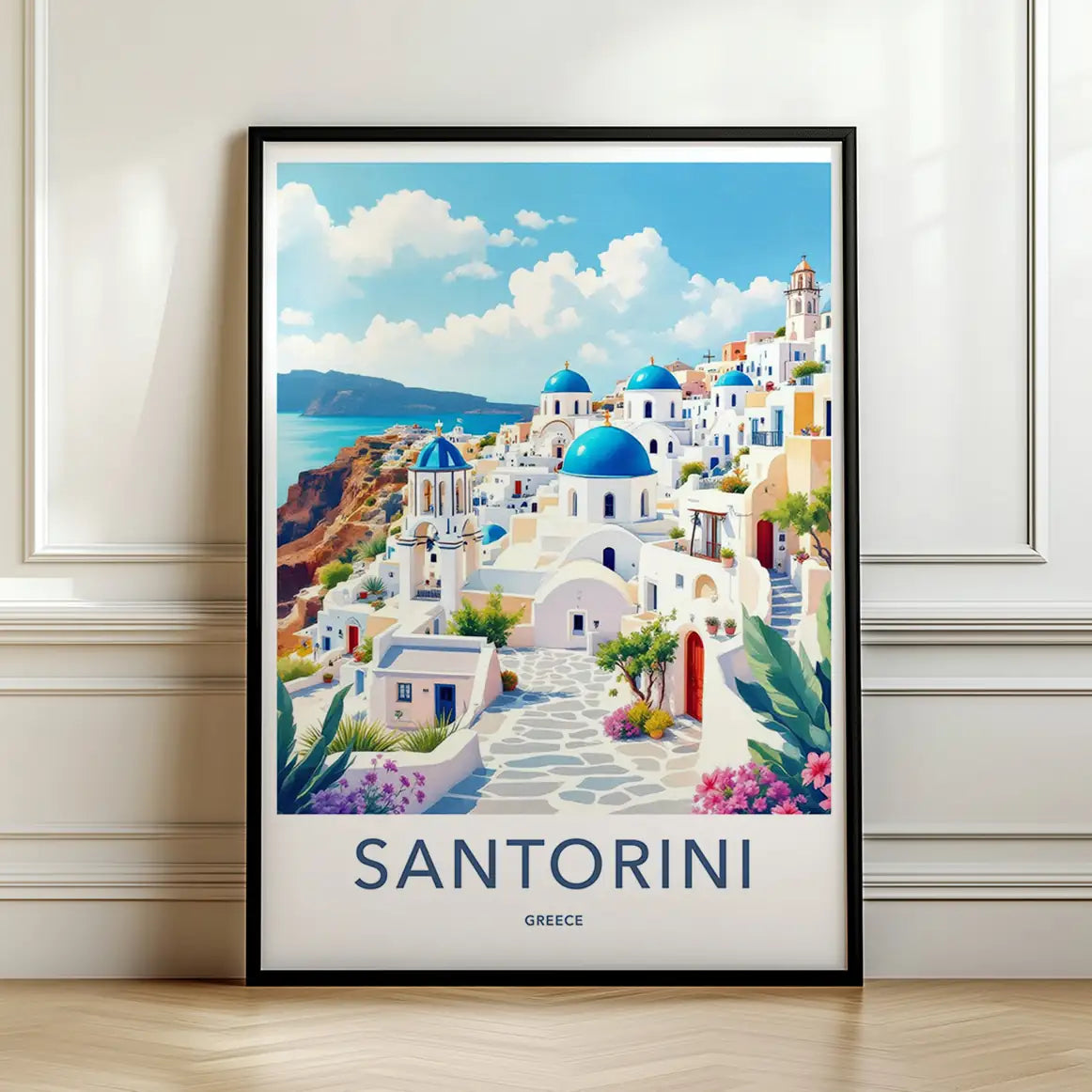 Framed artwork of Santorini, Greece with blue domes and white buildings along the coast.