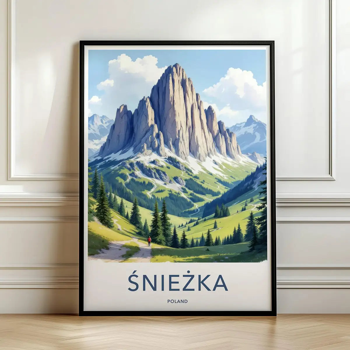 Framed poster of a mountain landscape with 'Sniezka' in Poland on a wall.